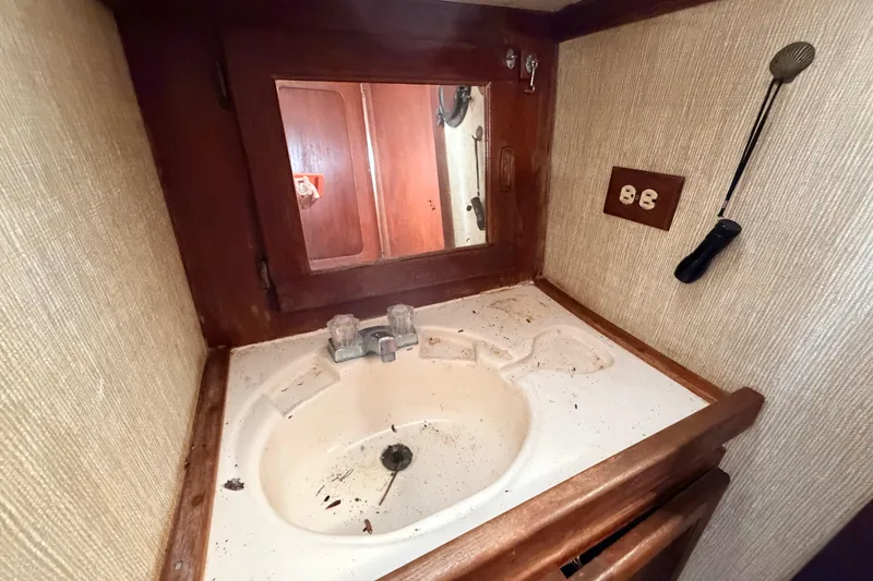 Slide: The Image of Small bathroom sink area on 1980 Hunter 37 Cherubini Cutter sailboat. - 36