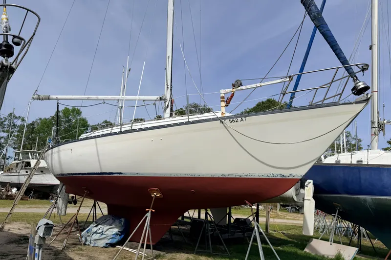 Slide: The Image of 1980 Hunter 37 Cherubini Cutter sailboat on stands, ready for maintenance. - 4