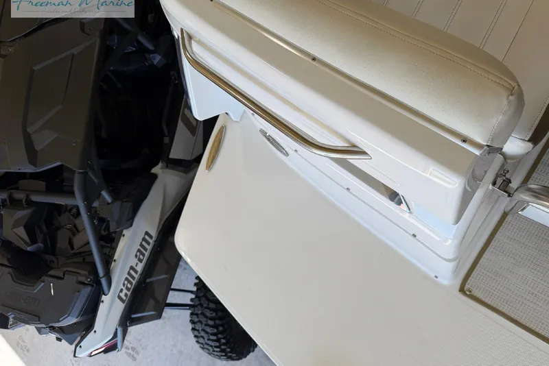 Slide: The Image of 2016 Marker One M25 boat interior with Can-Am vehicle nearby. - 17