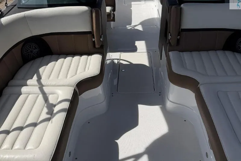 Slide: The Image of Interior of a 2016 Marker One M25 boat with cushioned seating. - 7