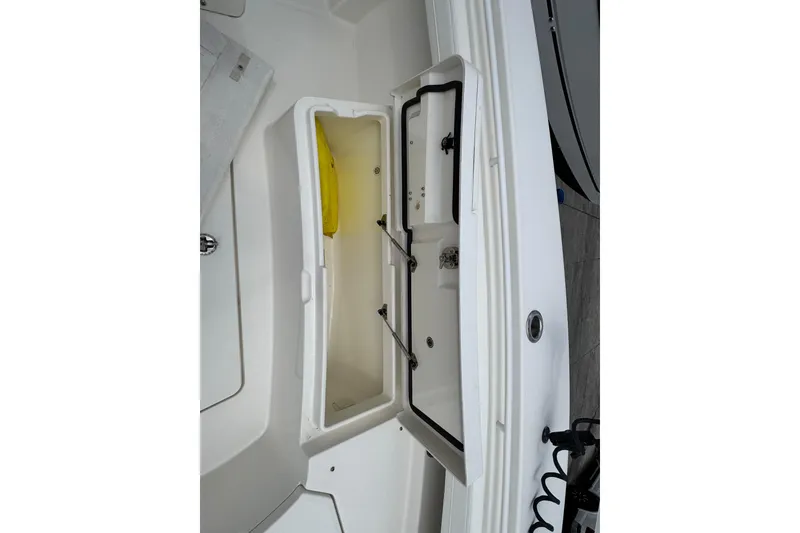 Slide: The Image of Open storage compartment on 2022 Regulator 28 boat, showcasing interior space. - 31