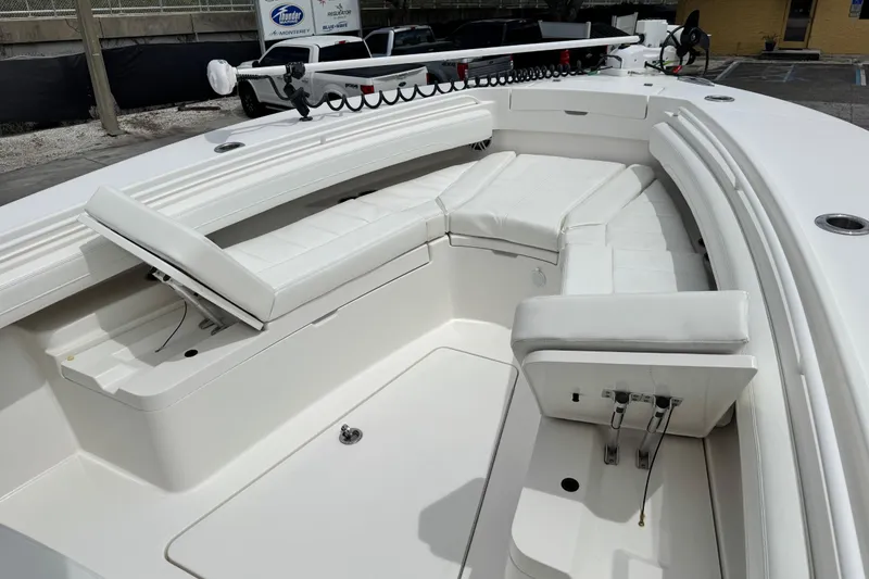 Slide: The Image of 2022 Regulator 28 boat with spacious white seating and modern design. - 34