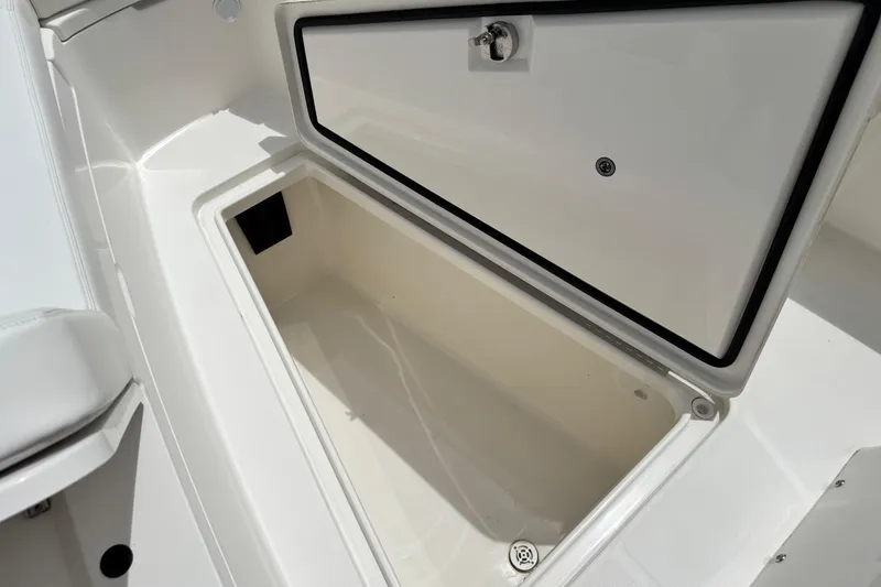 Slide: The Image of Open storage compartment on a 2022 Regulator 28 boat, showcasing interior space. - 38