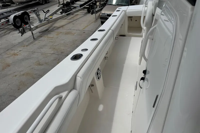 Slide: The Image of 2022 Regulator 28 boat interior with rod holders and storage compartments. - 39