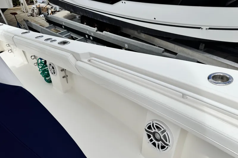 Slide: The Image of 2022 Regulator 28 boat interior with cup holders and speaker system. - 41