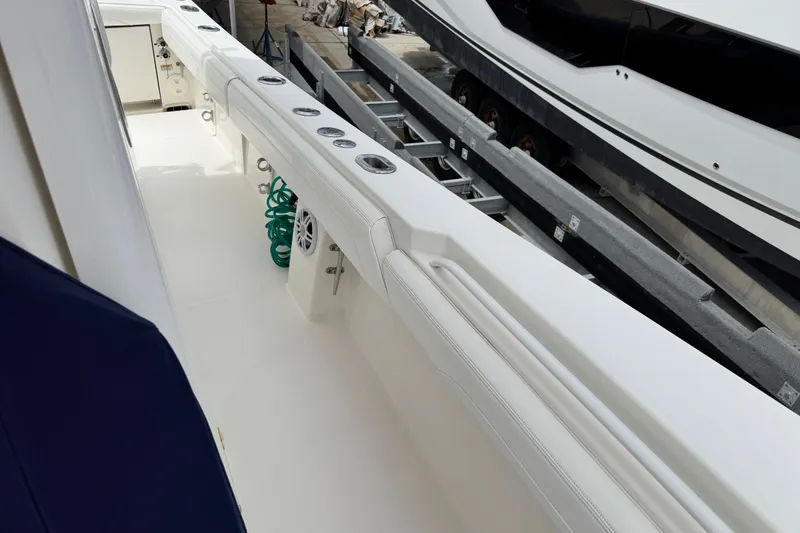 Slide: The Image of 2022 Regulator 28 boat deck with rod holders and storage compartments. - 42