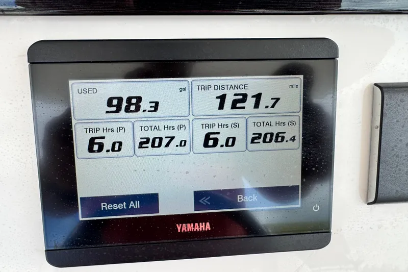 Slide: The Image of Yamaha display showing fuel usage and trip data on a 2022 Regulator 28 boat. - 49