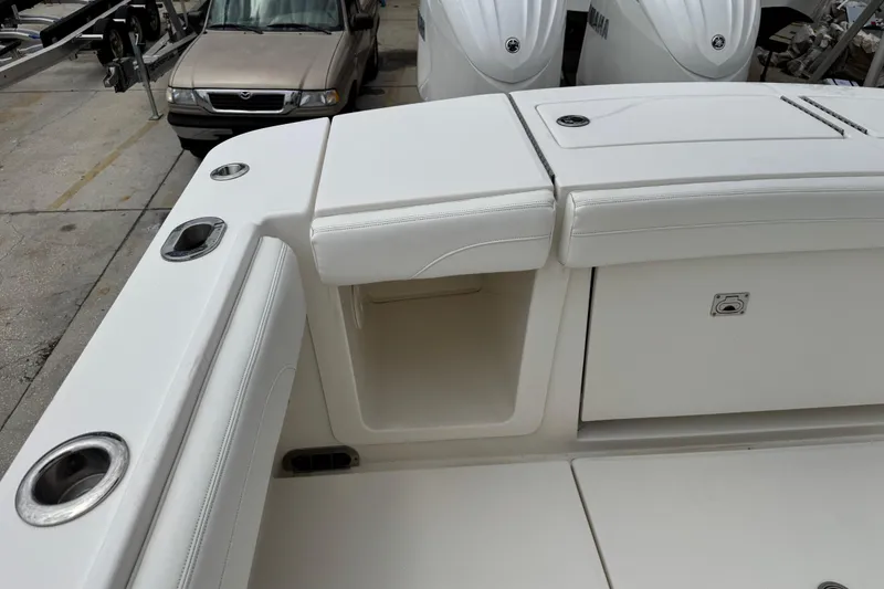 Slide: The Image of 2022 Regulator 28 boat interior with seating and storage compartments. - 60