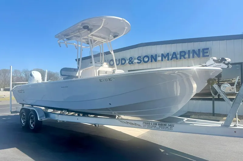 The Image of 2024 Carolina Skiff 26 Ultra Elite boat on trailer at marine dealership. - 1