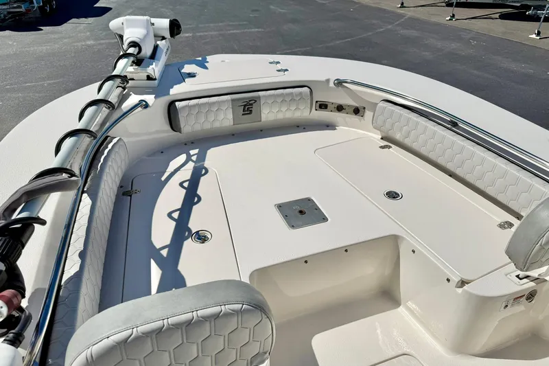 Slide: The Image of 2024 Carolina Skiff 26 Ultra Elite boat interior with cushioned seating and storage compartments. - 13