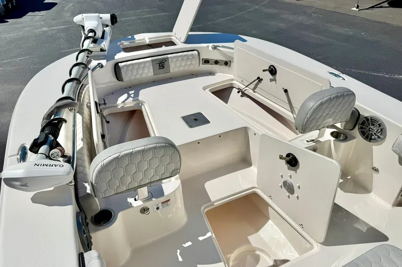 Slide: The Image of 2024 Carolina Skiff 26 Ultra Elite boat interior with seating and storage compartments. - 14