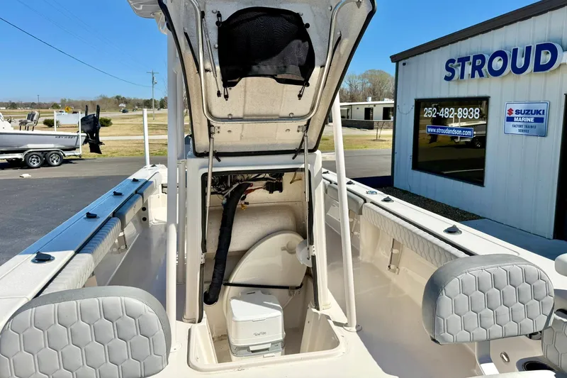 Slide: The Image of 2024 Carolina Skiff 26 Ultra Elite boat interior with storage compartment open. - 20