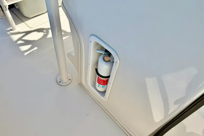 Slide: The Image of Fire extinguisher mounted on 2024 Carolina Skiff 26 Ultra Elite boat deck. - 21