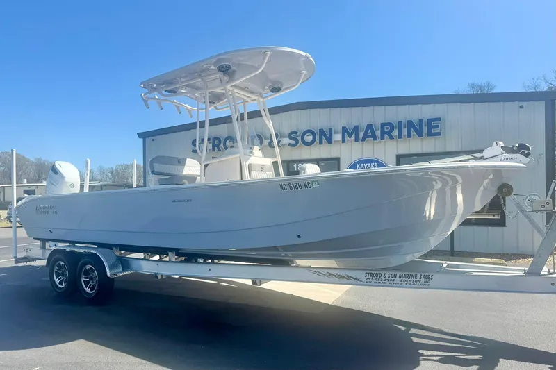 Slide: The Image of 2024 Carolina Skiff 26 Ultra Elite boat on trailer at marine dealership. - 6