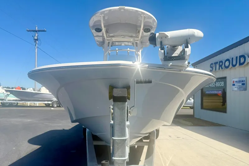 Slide: The Image of 2024 Carolina Skiff 26 Ultra Elite boat on trailer, sunny day at dealership. - 8