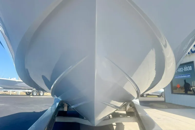 Slide: The Image of 2024 Carolina Skiff 26 Ultra Elite boat hull on trailer, close-up view. - 9