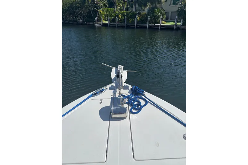 Slide: The Image of Bow view of 2009 SeaHunter 40 Center Console with anchor and blue rope. - 13