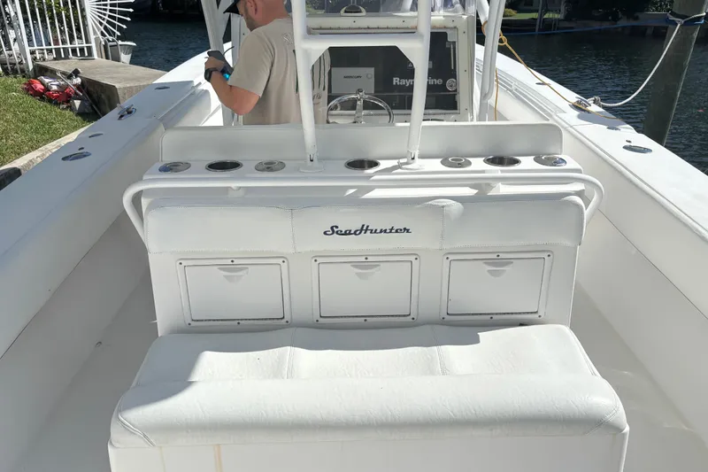 Slide: The Image of 2009 SeaHunter 40 Center Console boat interior with seating and storage compartments. - 5