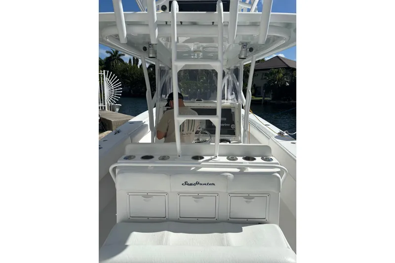 Slide: The Image of 2009 SeaHunter 40 Center Console boat interior with seating and storage compartments. - 8