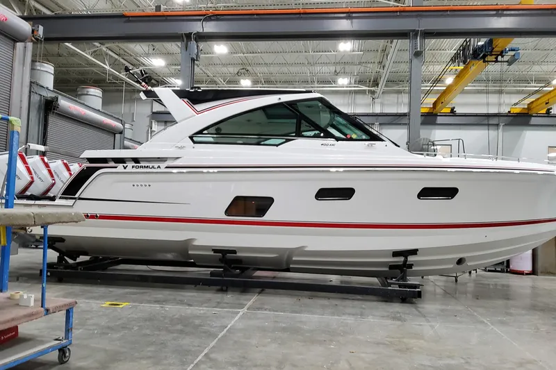 The Image of 2026 Formula 400 Super Sport Crossover boat in a manufacturing facility. - 0