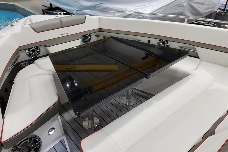 Slide: The Image of 2026 Formula 400 Super Sport Crossover boat interior with sleek seating and modern table design. - 14