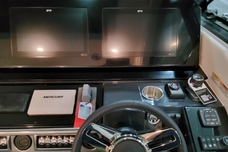 Slide: The Image of Dashboard of 2026 Formula 400 Super Sport Crossover with dual screens and Mercury controls. - 18