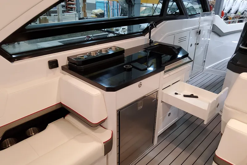 Slide: The Image of Interior of 2026 Formula 400 Super Sport Crossover yacht with sleek kitchenette and seating. - 19