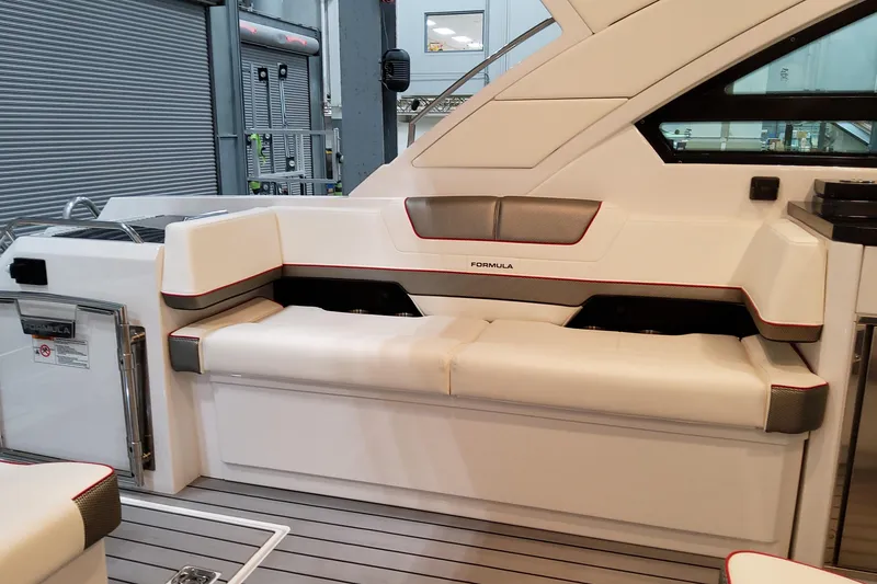 Slide: The Image of 2026 Formula 400 Super Sport Crossover boat interior with sleek white seating and modern design. - 22