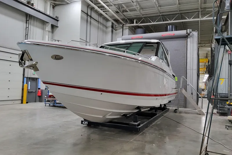 Slide: The Image of 2026 Formula 400 Super Sport Crossover boat in a manufacturing facility. - 3