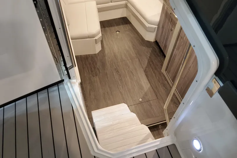 Slide: The Image of Interior view of 2026 Formula 400 Super Sport Crossover with sleek wood flooring and seating. - 31