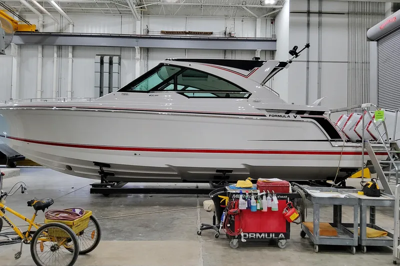 Slide: The Image of 2026 Formula 400 Super Sport Crossover boat in a workshop setting. - 4