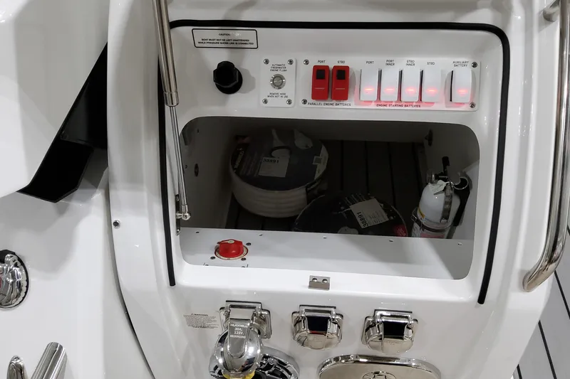 Slide: The Image of Control panel of 2026 Formula 400 Super Sport Crossover boat with switches and storage compartment. - 7