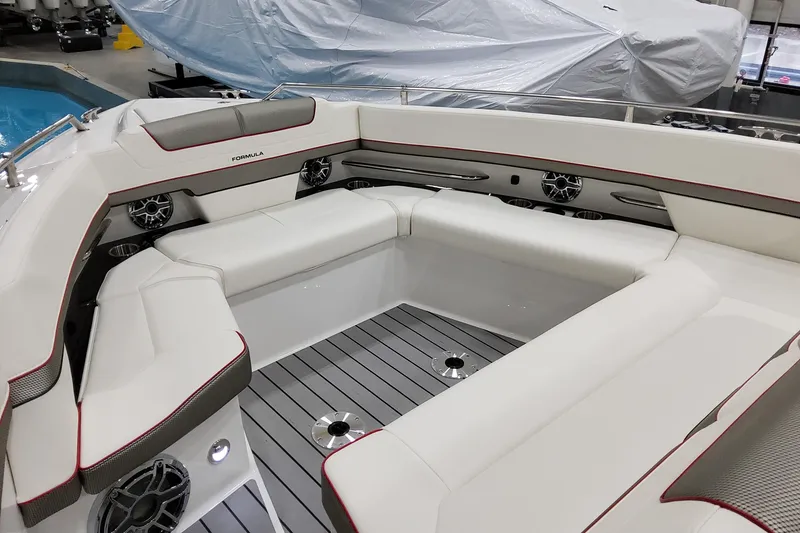 Slide: The Image of 2026 Formula 400 Super Sport Crossover boat interior with luxurious white seating and modern design. - 9