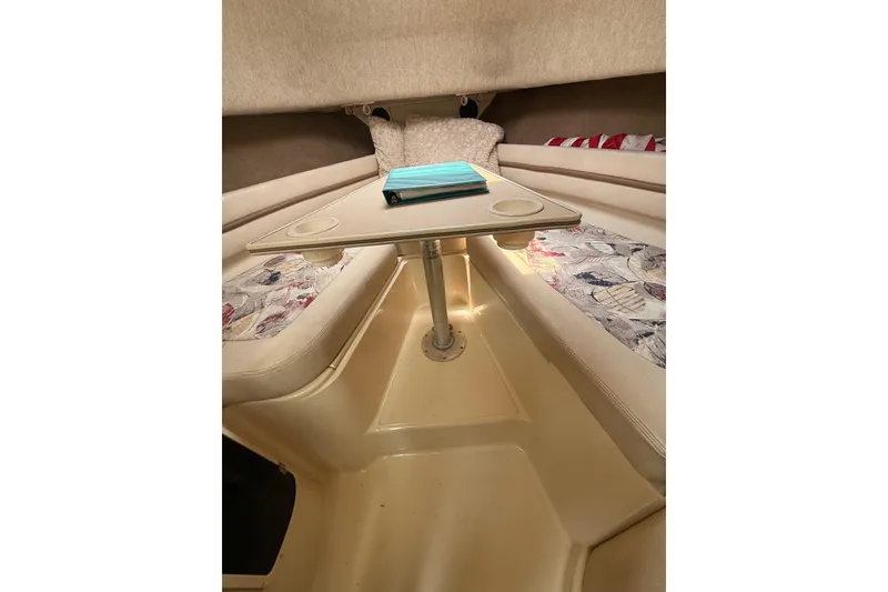 Slide: The Image of Interior cabin of 1999 Grady-White Marlin 300 boat with table and seating. - 25