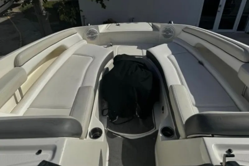 Slide: The Image of 2012 Sea Ray 260 Sundeck boat interior with spacious seating and cup holders. - 10