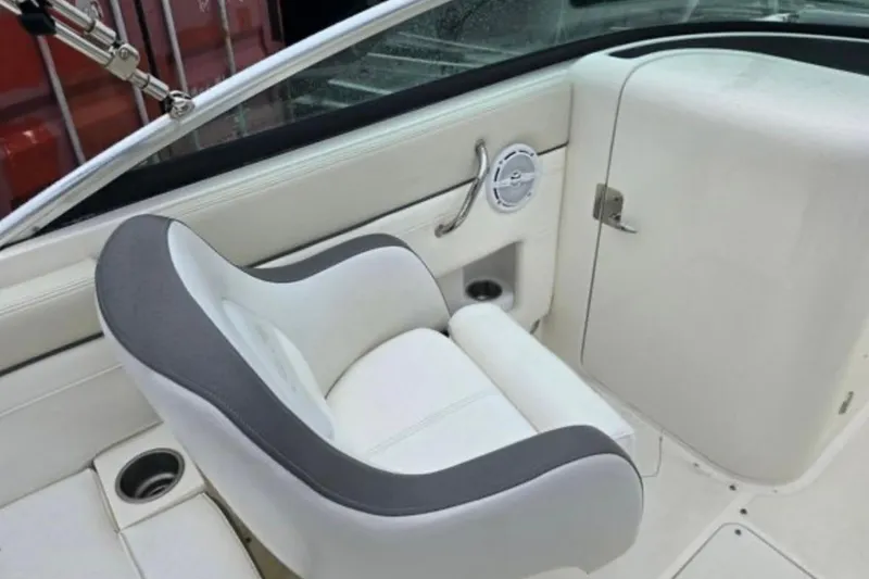 Slide: The Image of Interior of a 2012 Sea Ray 260 Sundeck boat, featuring a comfortable seat and speaker. - 8