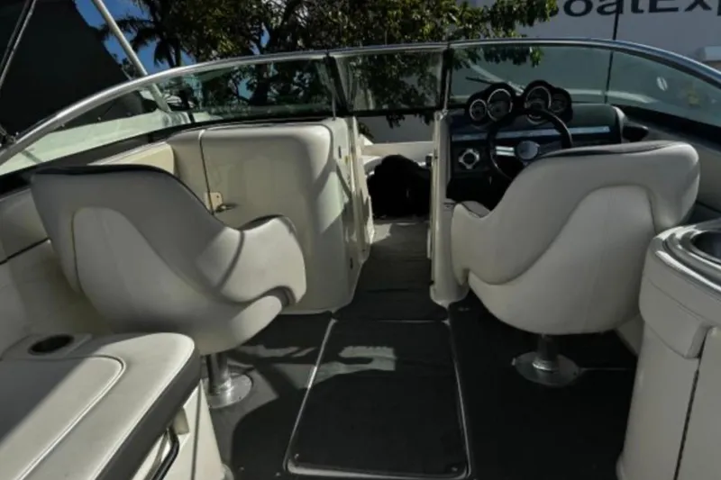 Slide: The Image of Interior of 2012 Sea Ray 260 Sundeck boat with white seating and dashboard. - 9