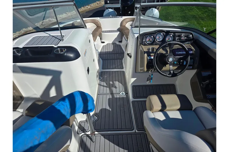 Slide: The Image of 2011 Yamaha Boats SX240 HO interior with steering wheel and seating. - 11