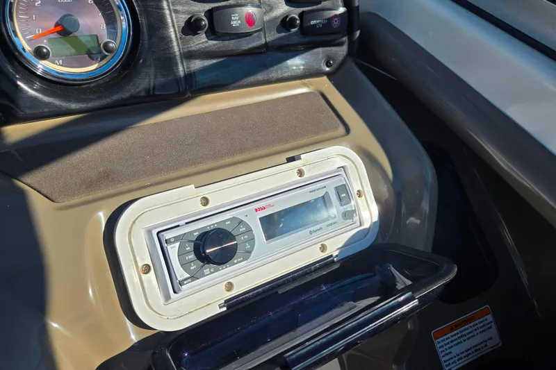 Slide: The Image of Dashboard of 2011 Yamaha Boats SX240 HO with stereo system and controls. - 13