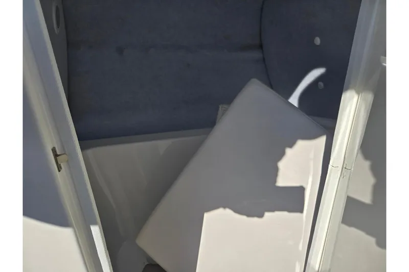 Slide: The Image of Interior storage compartment of 2011 Yamaha Boats SX240 HO. - 14