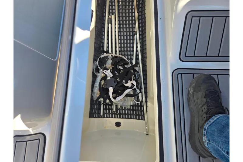 Slide: The Image of 2011 Yamaha SX240 HO boat deck with storage compartment and accessories. - 15