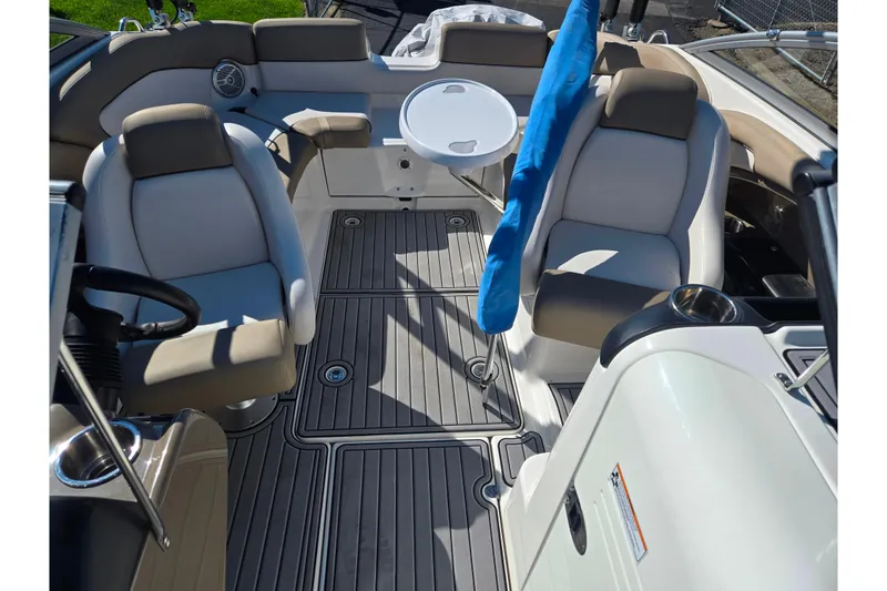 Slide: The Image of 2011 Yamaha Boats SX240 HO interior with seating and table, showcasing modern design. - 21