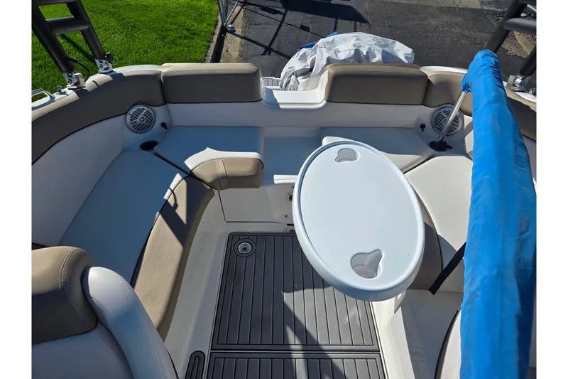 Slide: The Image of 2011 Yamaha Boats SX240 HO interior with seating and table setup. - 22