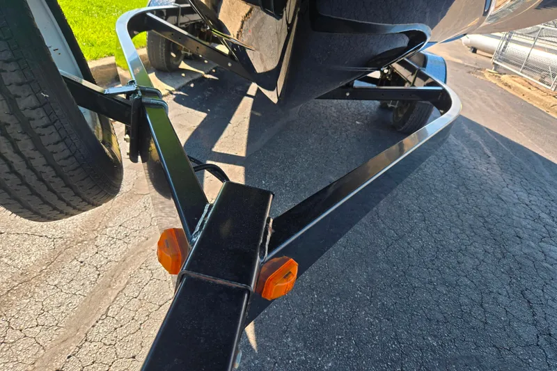 Slide: The Image of 2011 Yamaha Boats SX240 HO on trailer, close-up view of trailer frame and wheels. - 7