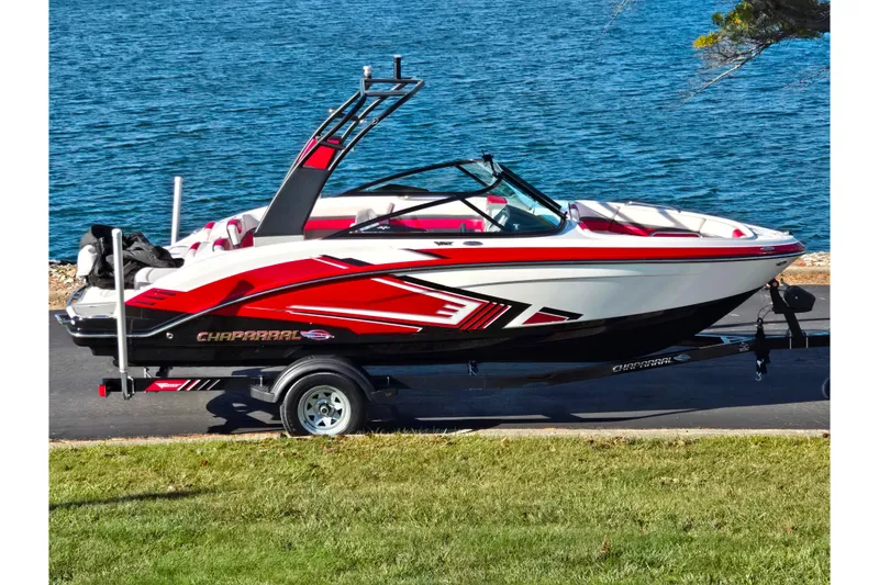 The Image of 2016 Chaparral Vortex 203 VRX boat on trailer by a lake. - 0