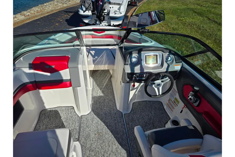 Slide: The Image of 2016 Chaparral Vortex 203 VRX boat interior with modern dashboard and seating. - 11