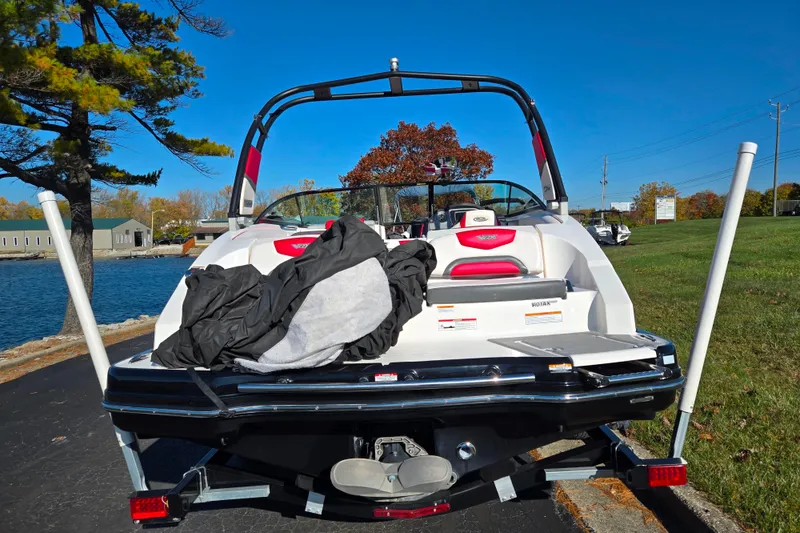 Slide: The Image of 2016 Chaparral Vortex 203 VRX boat on trailer by lakeside, sunny day. - 2