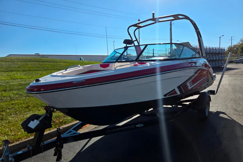 Slide: The Image of 2016 Chaparral Vortex 203 VRX boat on trailer, parked outdoors under clear sky. - 5
