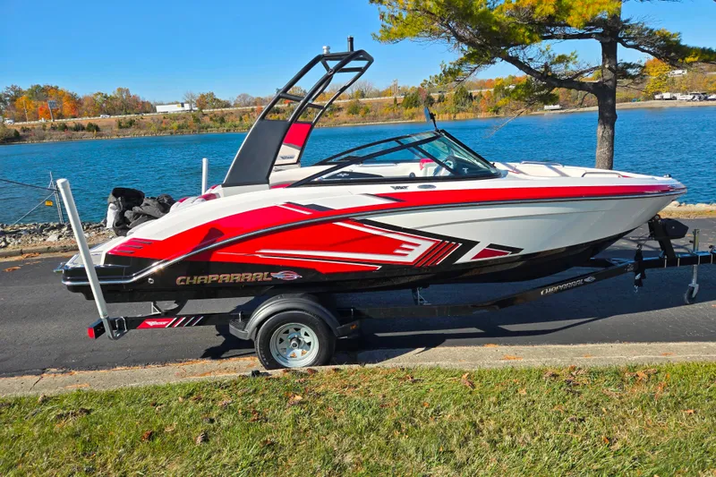 Slide: The Image of 2016 Chaparral Vortex 203 VRX boat on trailer by a scenic lake. - 9