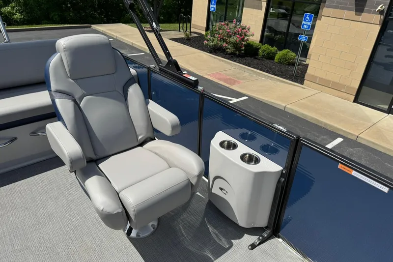 Slide: The Image of Luxurious seating on 2024 Crest Caribbean LX 230 boat with cup holders. - 10